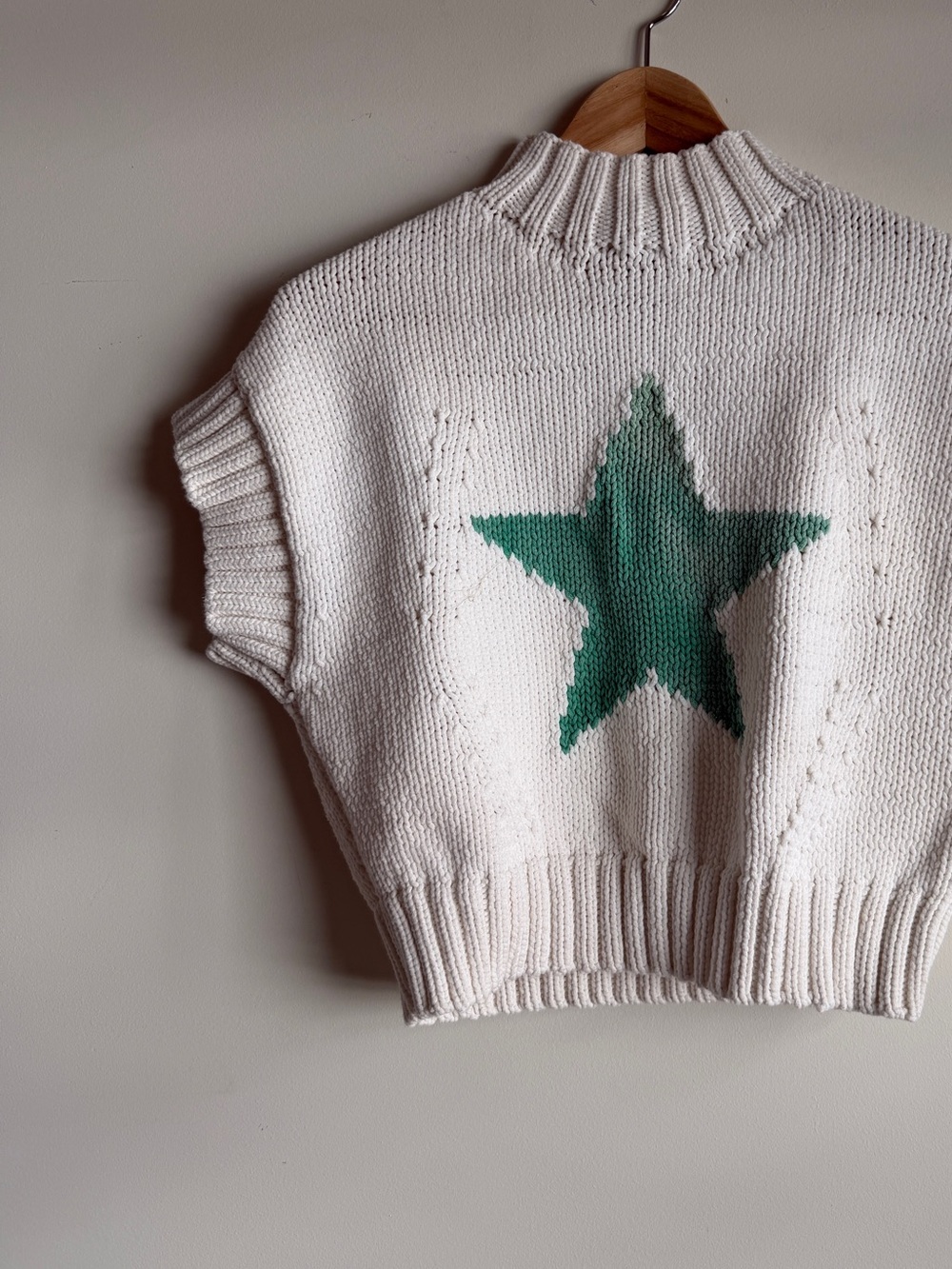 Maeve Cream Knit Sleeveless Turtleneck Sweater with Green Star